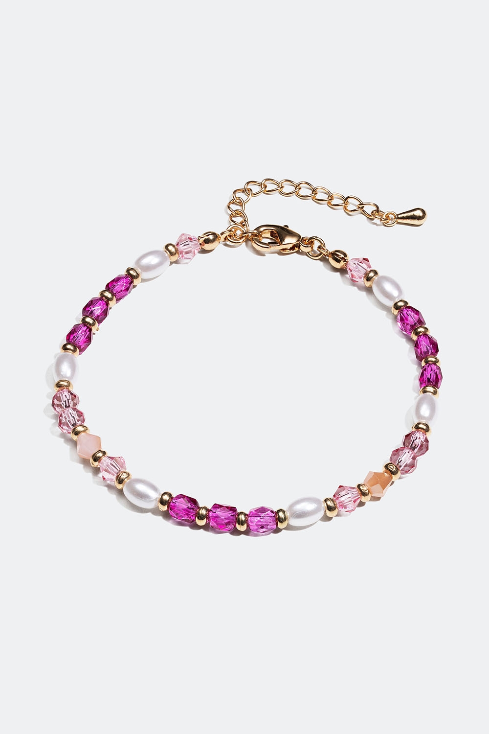 Armbånd i guldfarvet metal med rosa perler i gruppen Smykker / Armbånd / Tynde hos Glitter (251000955402)