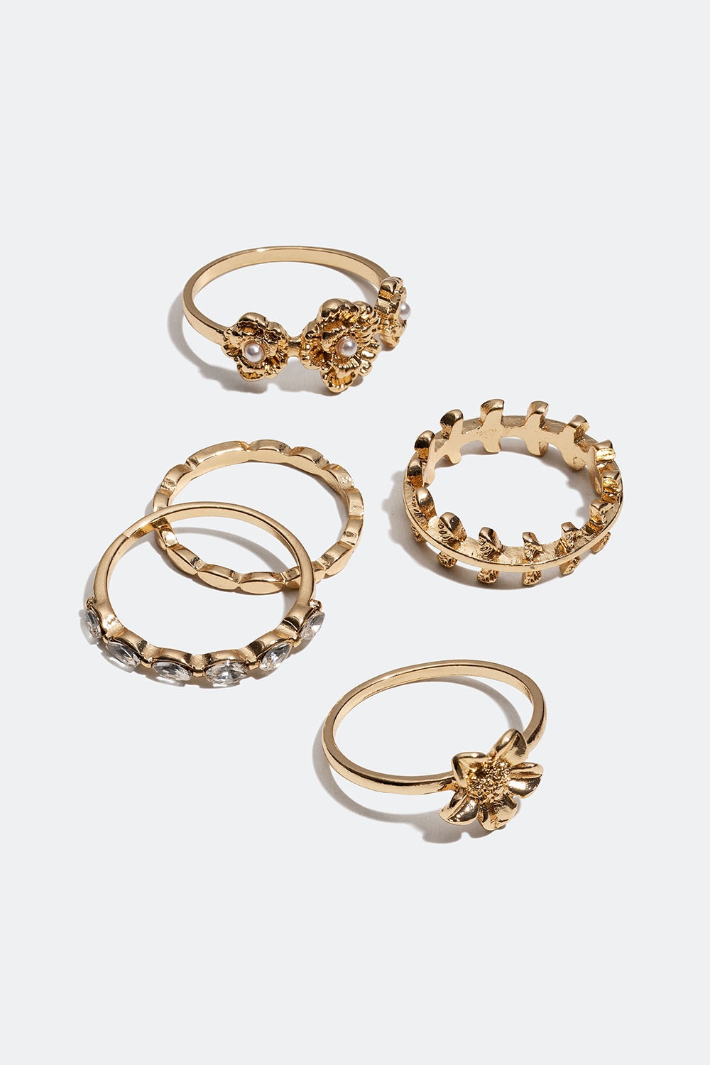 Guldfarvede ringe med blomster og glassten, 5-pak i gruppen Smykker / Ringe / Flerpak hos Glitter (256000992)