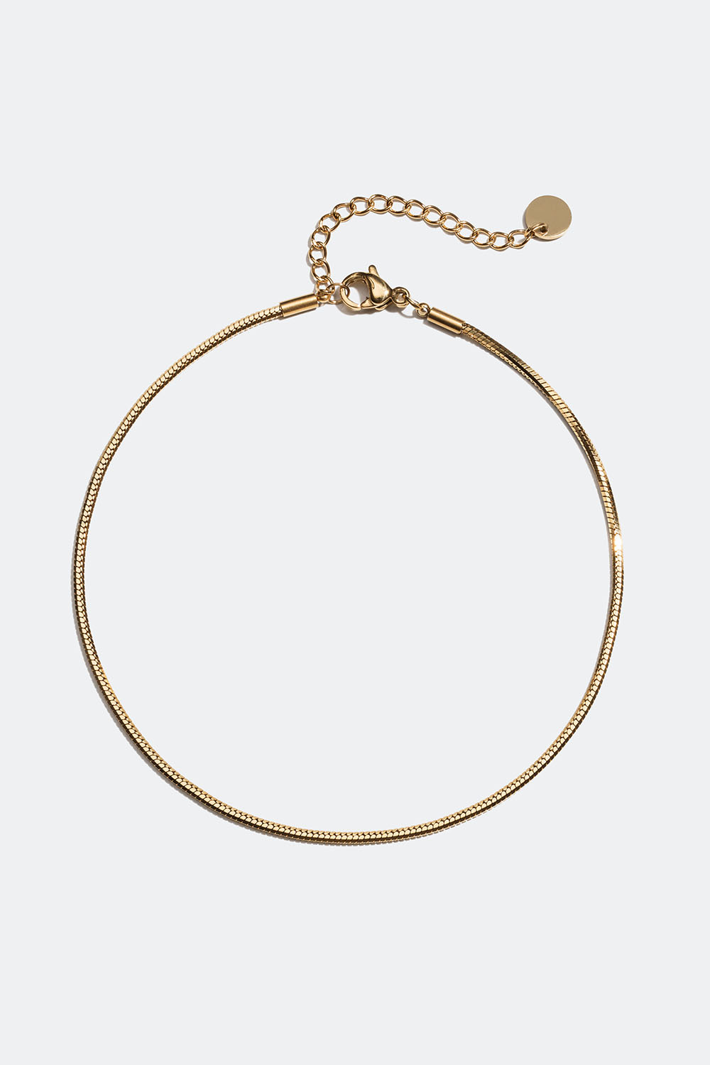 Ankelkæde i stål med afrundet slangekæde i 18k guld