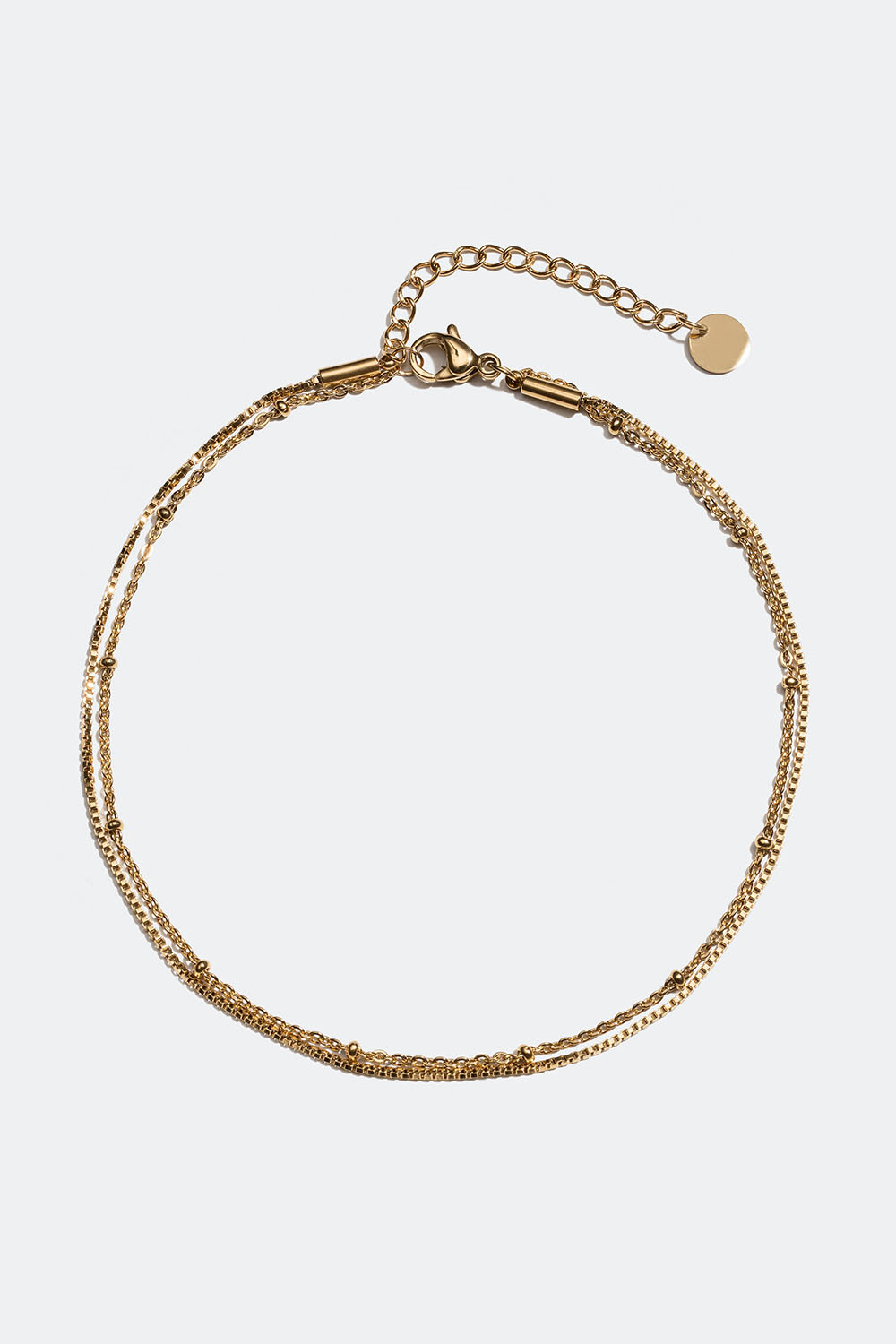 Ankelkæde i stål med dobbeltled i 18k guld