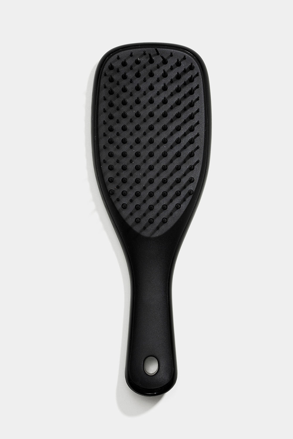 Lille, sort detangler-hårbørste
