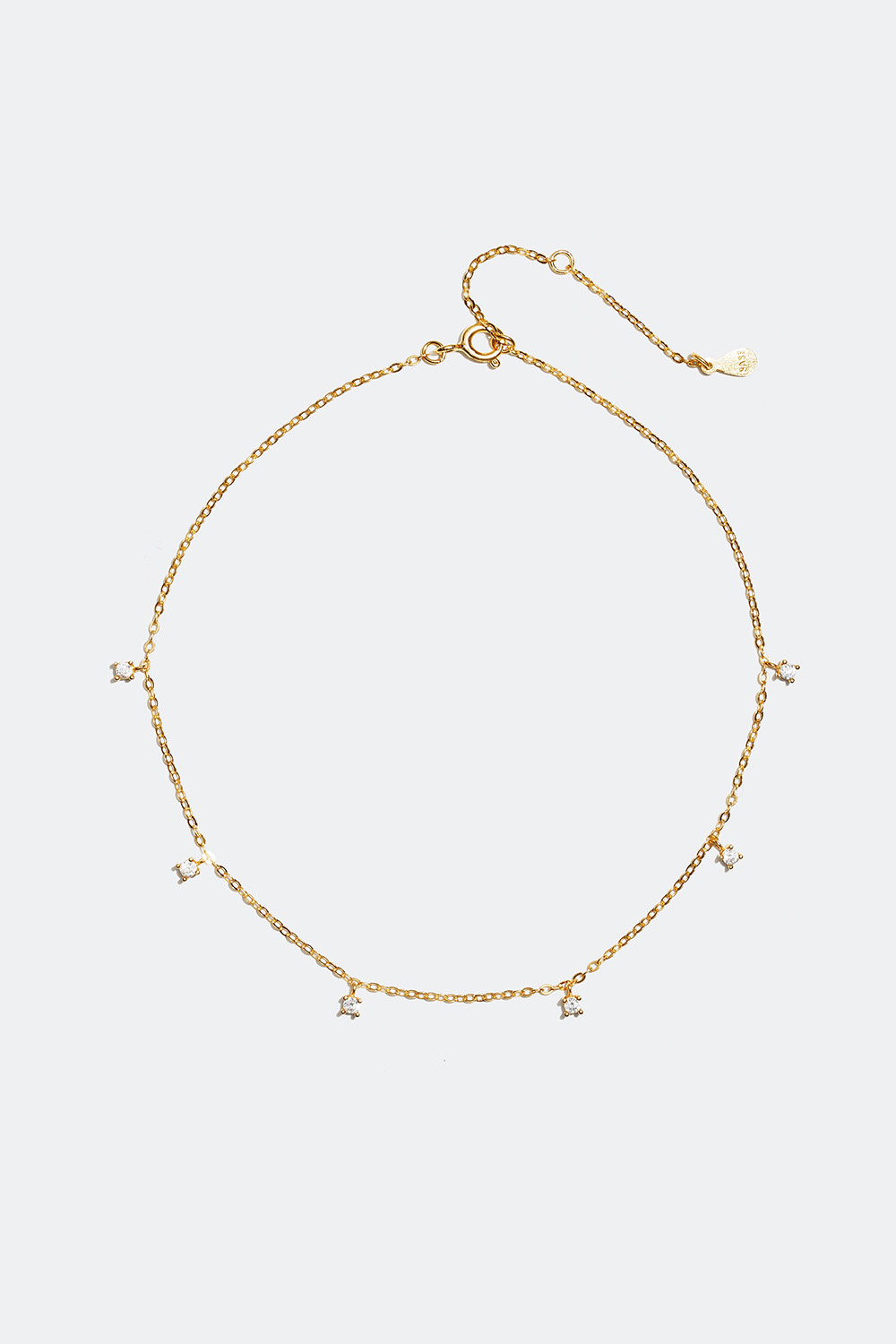 Ankelkæde med sten i kubisk zirkonia, forgyldt med 18 kt. guld